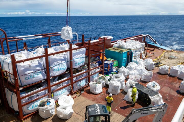 The collected garbage is loaded onto ships for onshore recycling